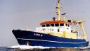 An old photograph of the vessel Aurelia, already painted in the distinguised NIOZ colours: blue keel, orange roof.