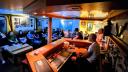 The cosy Pelagia bar is filled with both cruise participants and crew