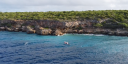 Rubber boat sampling above a coral reef near the coast.