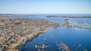 The damaged Irpin dam and the flooded landscape around the village of Demydiv located north to Kyiv, in late February 2022. | Photo: Vincent Mundy