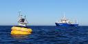 One of the dust-collecting buoys that monitors Saharan dust in the eastern Atlantic. In the background RV Pelagia
